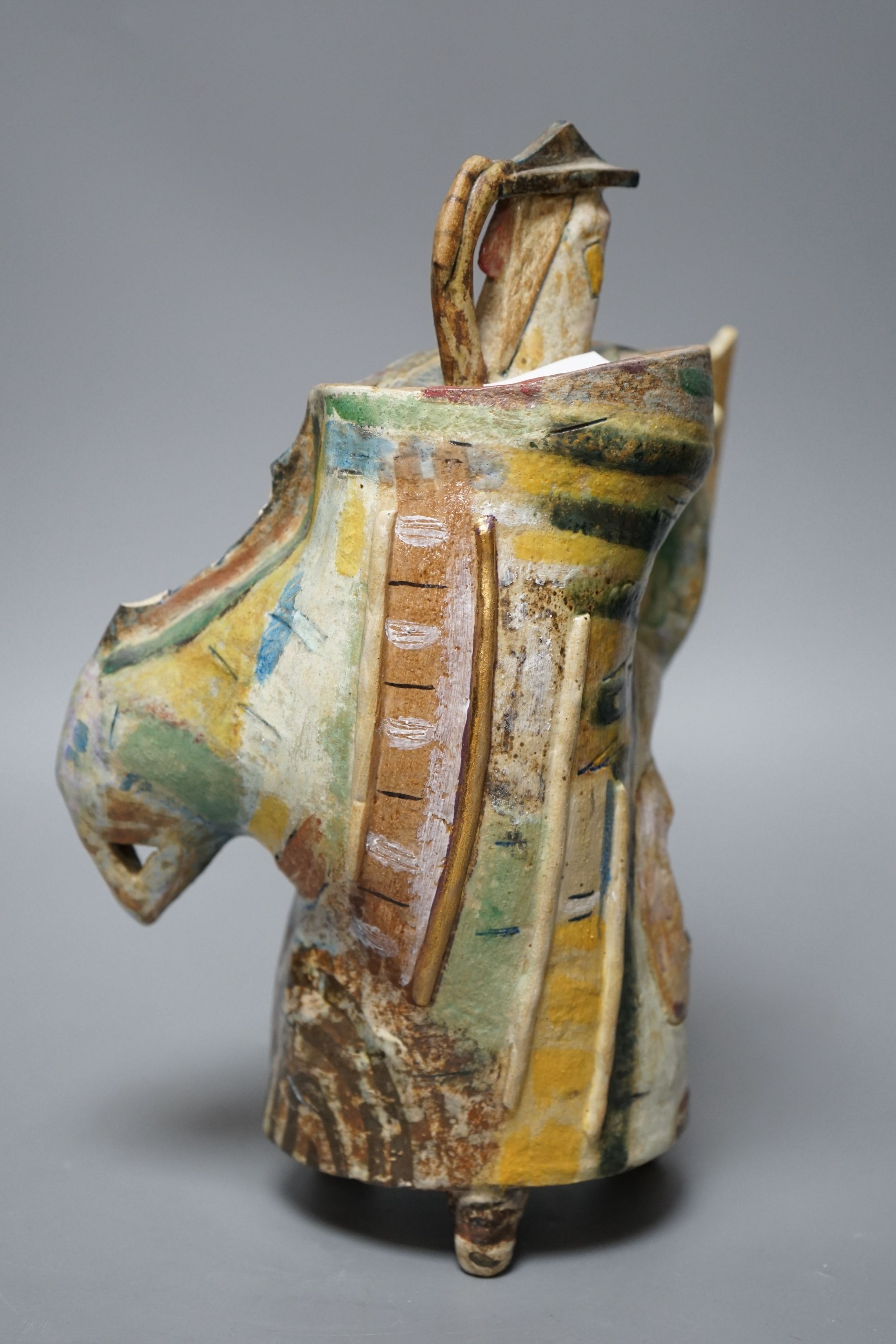 Angus Suttie (1946-1993), an abstract polychrome glazed stoneware jug and cover on tripod base, inscribed ‘Angus 86’, 29cm tall (Damage)